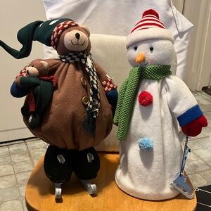 Like new. Set of 2 Christmas friends hanging out n going skating. Large size 18”